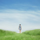 Girl walking on grass field